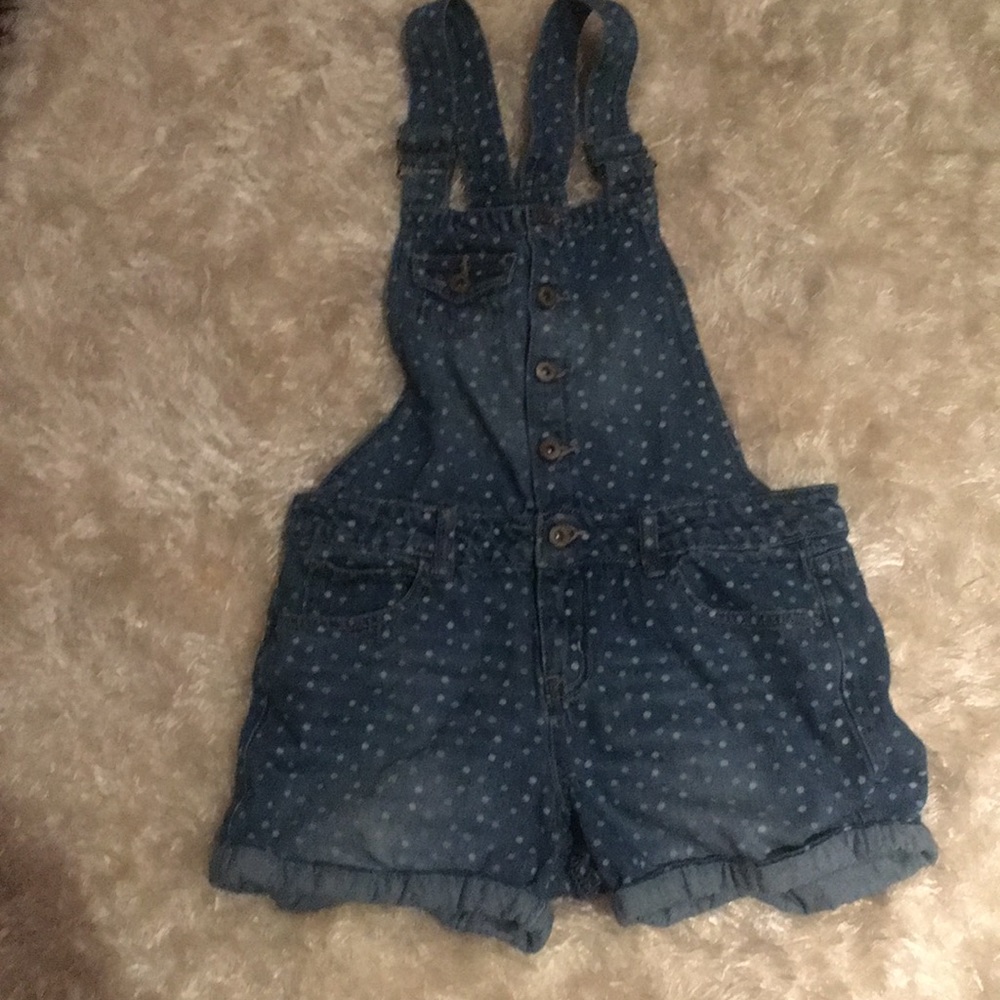 A denim dumper with rainbow dots